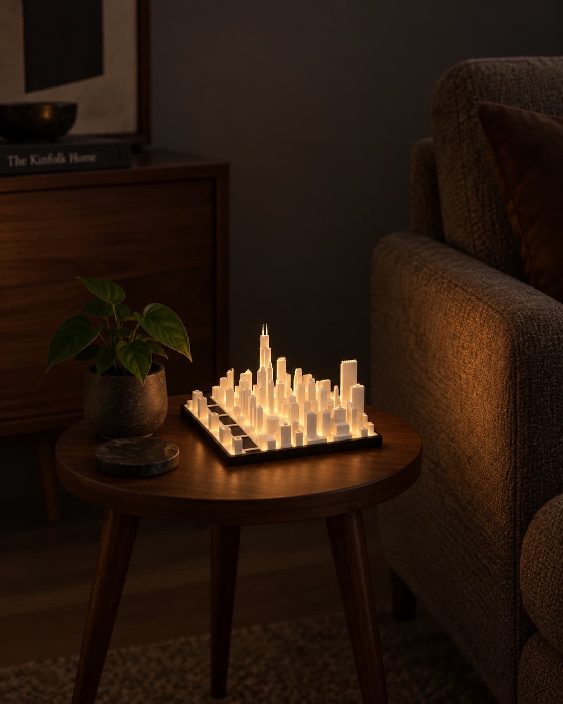 Chicago Skyline Lamp lit on a side table in a living room