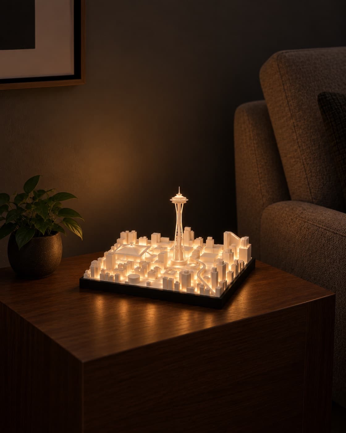 Seattle Skyline Lamp lit on a side table in a living room